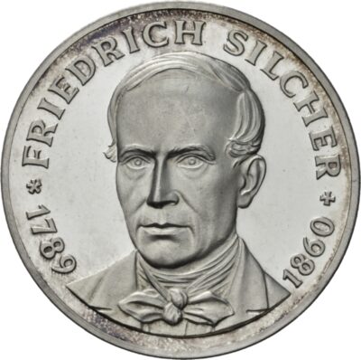 Eine Münze auf der ein Gesicht abgebildet ist. Um den Kopf herum steht die Inschrift: "1789 * FRIEDRICH SILCHER + 1860"